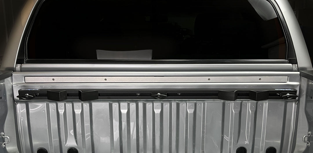 Horizontal view of the Hybrid Moto Rack installed in the bed of a Toyota Tundra truck bed.