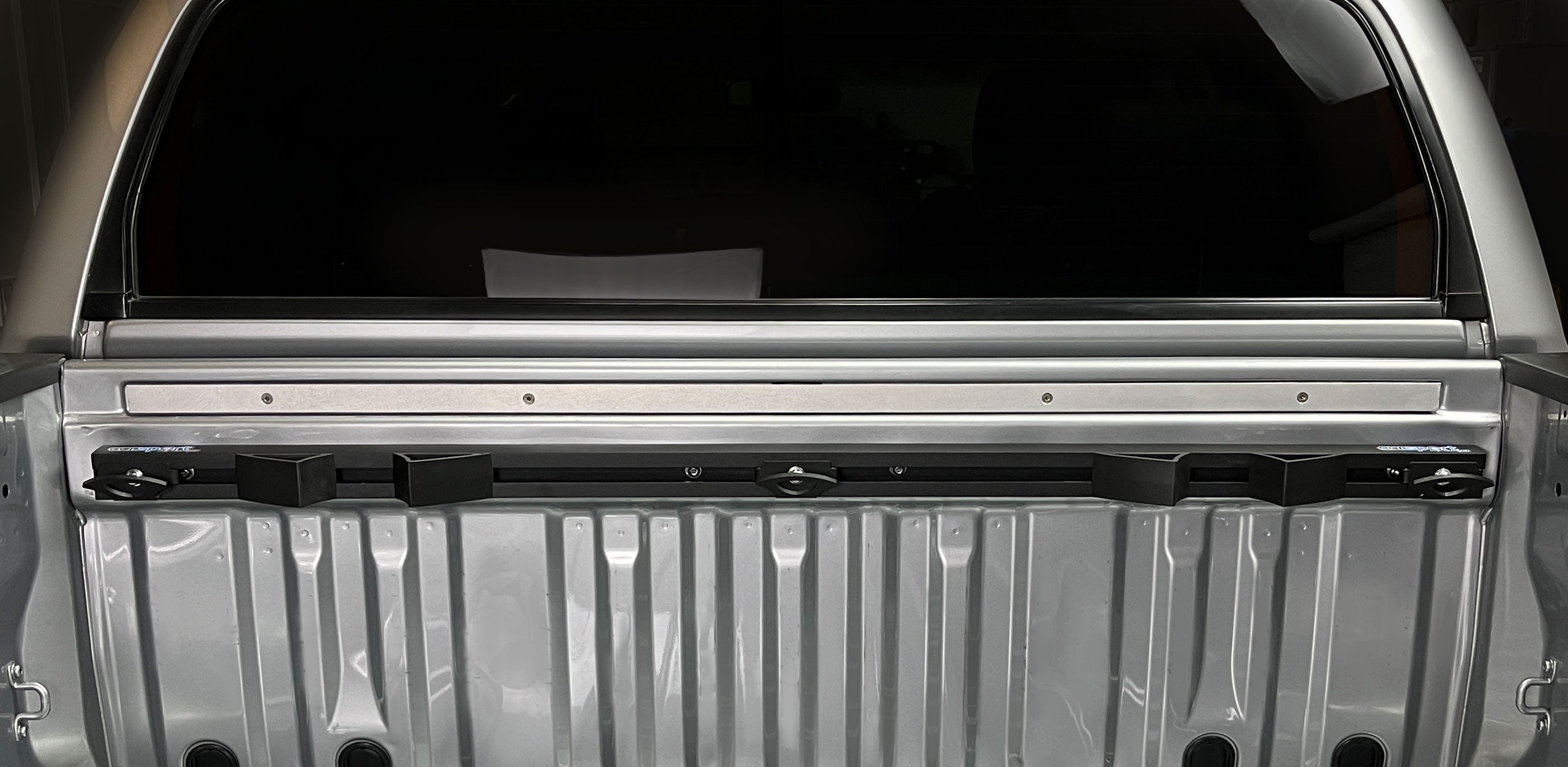 Horizontal view of the Hybrid Moto Rack installed in the bed of a Toyota Tundra truck bed.