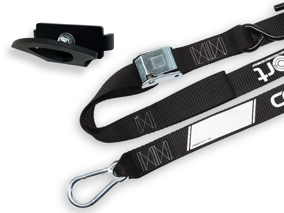 Hybrid Tie Down Anchor and a Pro Moto tie down strap on a white studio background.