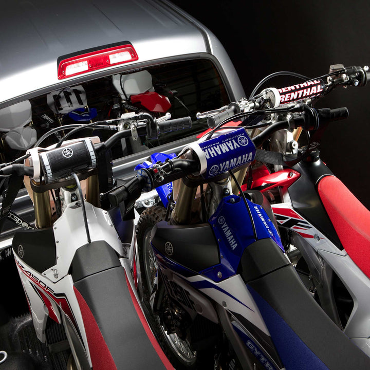 This image shows three motorcycles with clearance from the handlebars using the Offset Wheel Chock.