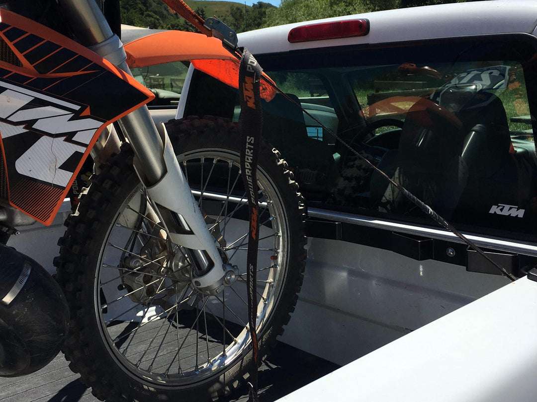 A CCR Sport Bed Buddy mounted in a Ford Ranger and supporting a single off road motorcycle.