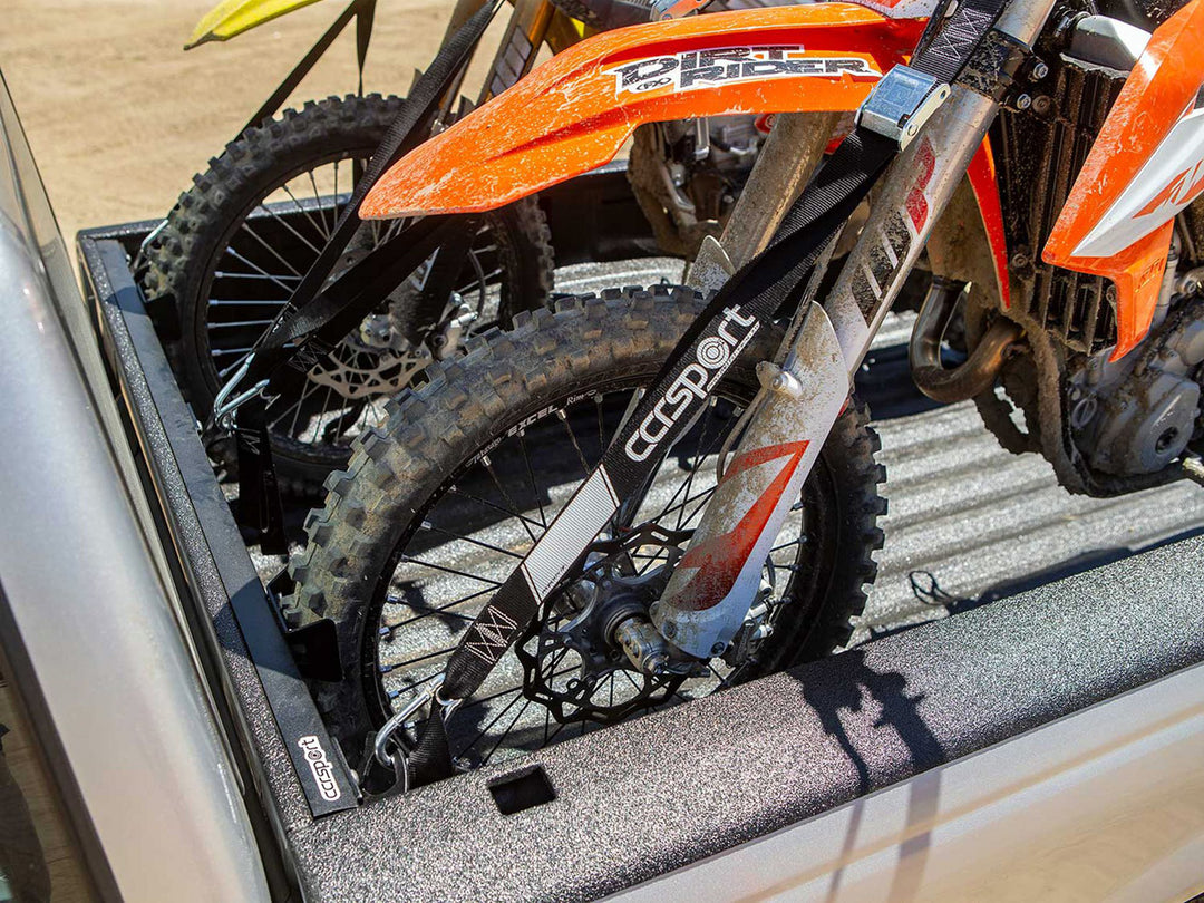 A Ford Ranger with the CCR Sport motorcycle tie down rack supporting two motorcycles.