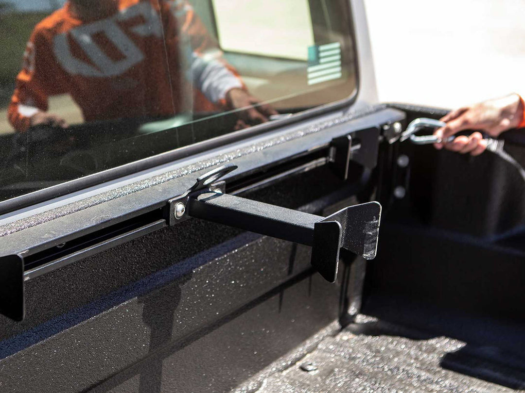 The Offset wheel Chock shown with the CCR Sport Moto Rack mounted in the bed of a Ford Ranger truck.
