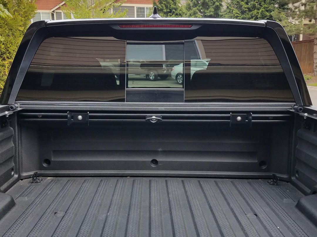 CCR Sport motorcycle transport mounting system installed along the front wall of a Honda Ridgeline truck bed.