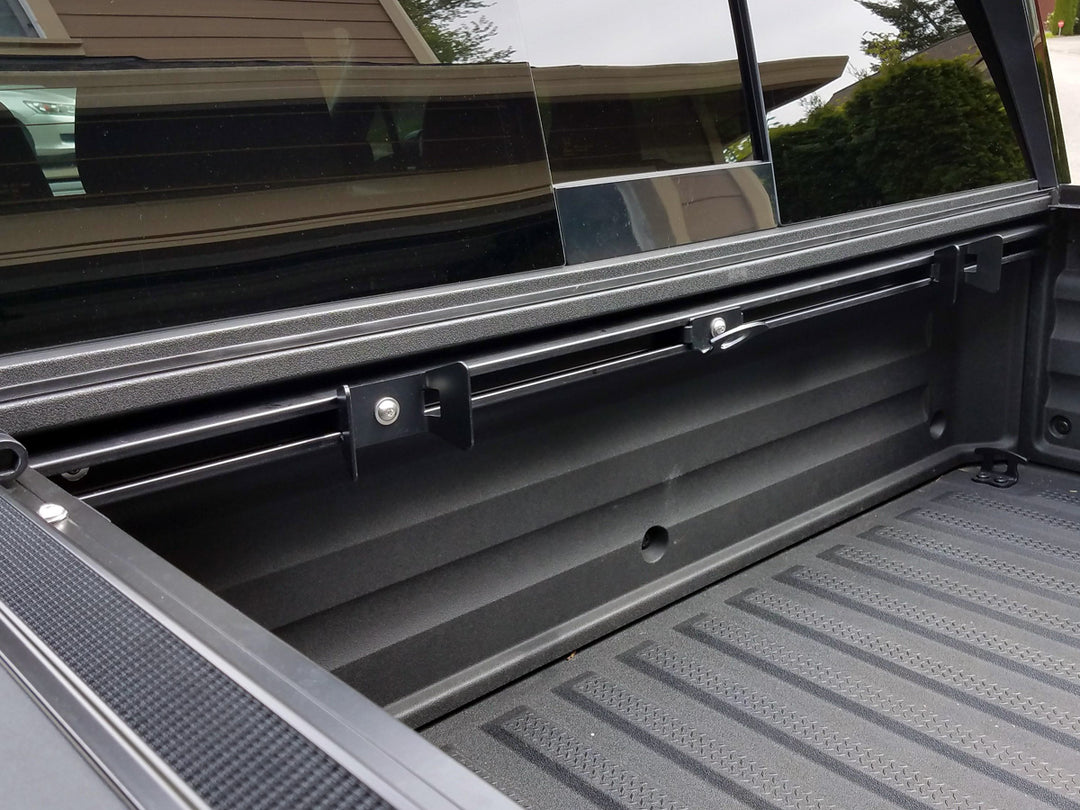 CCR Sport motorcycle transport mounting system installed along the front wall of a Honda Ridgeline truck bed.