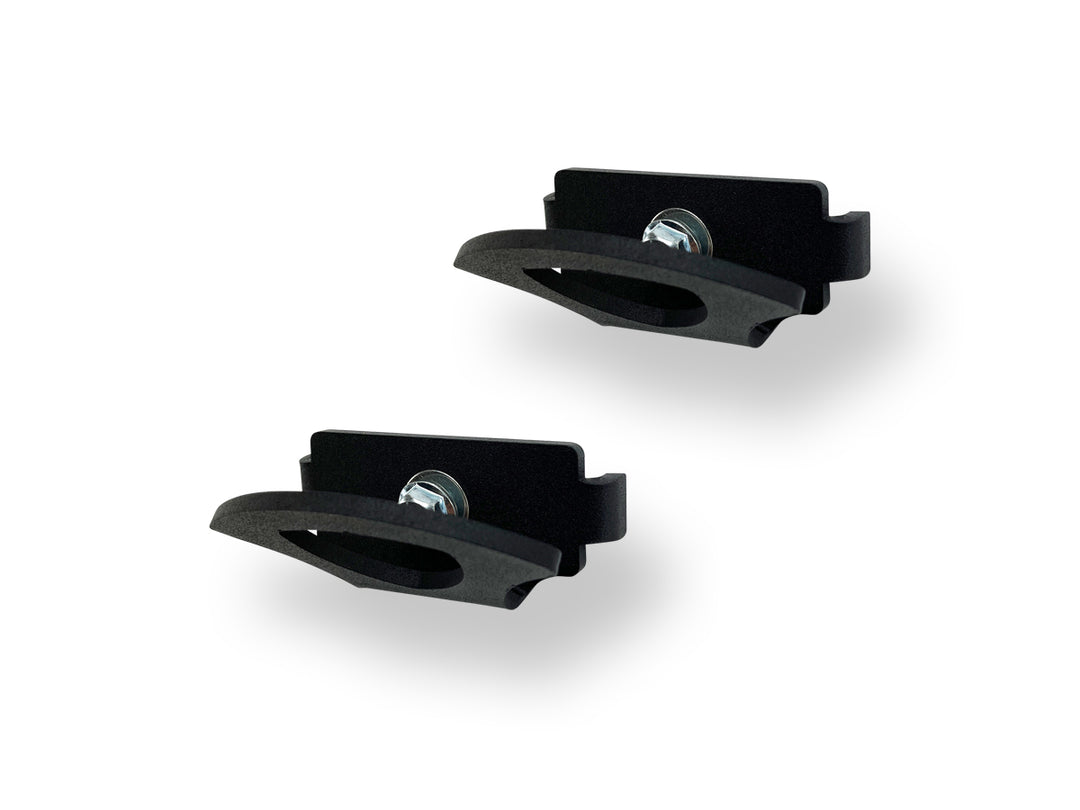 Two tie-down anchors on a white background.