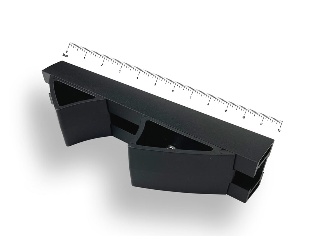 Micro moto rack with a ruler on top against a white background