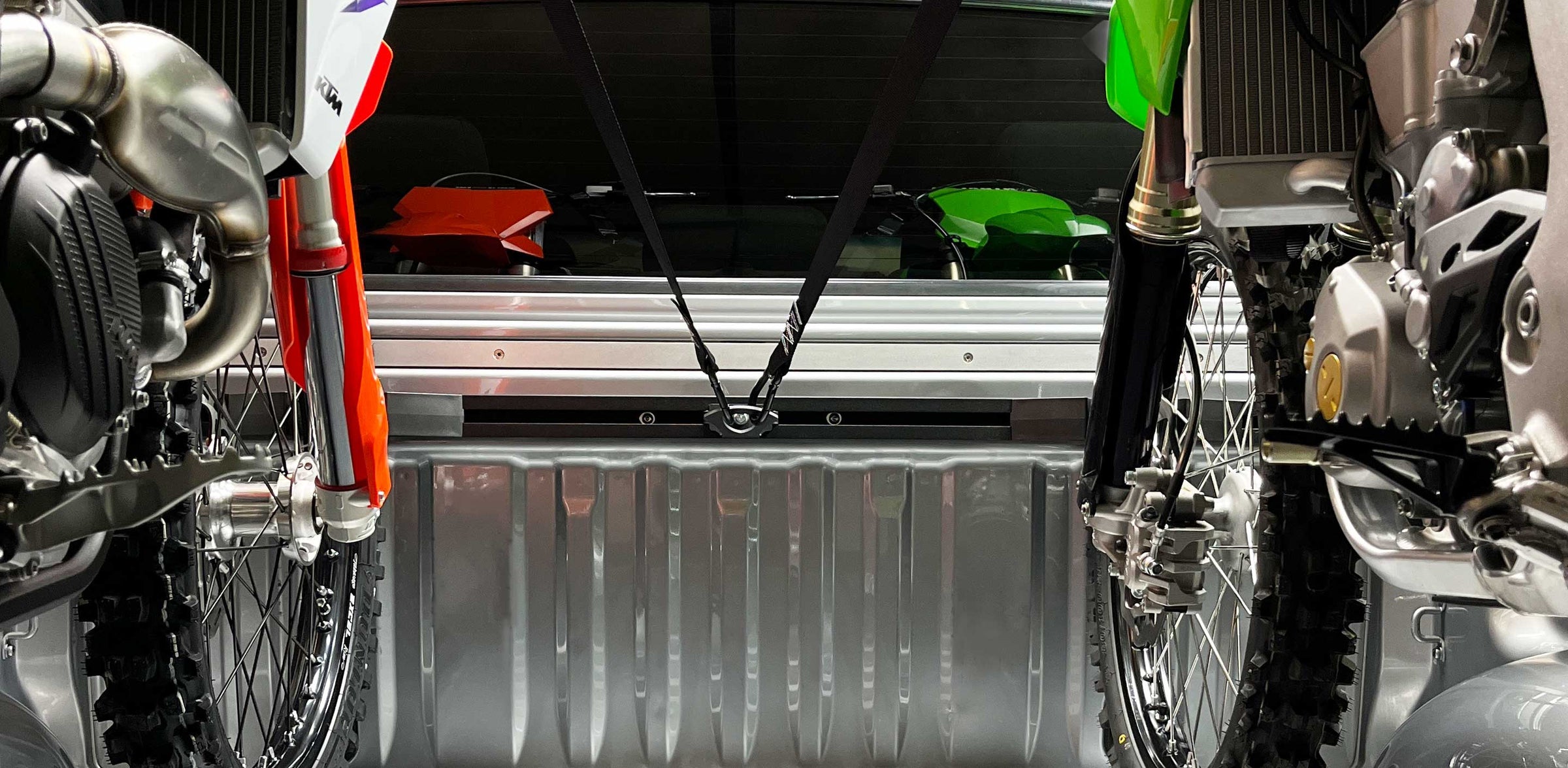 Forward facing point of view of two motorcycles loaded into the Hybrid Moto Rack.