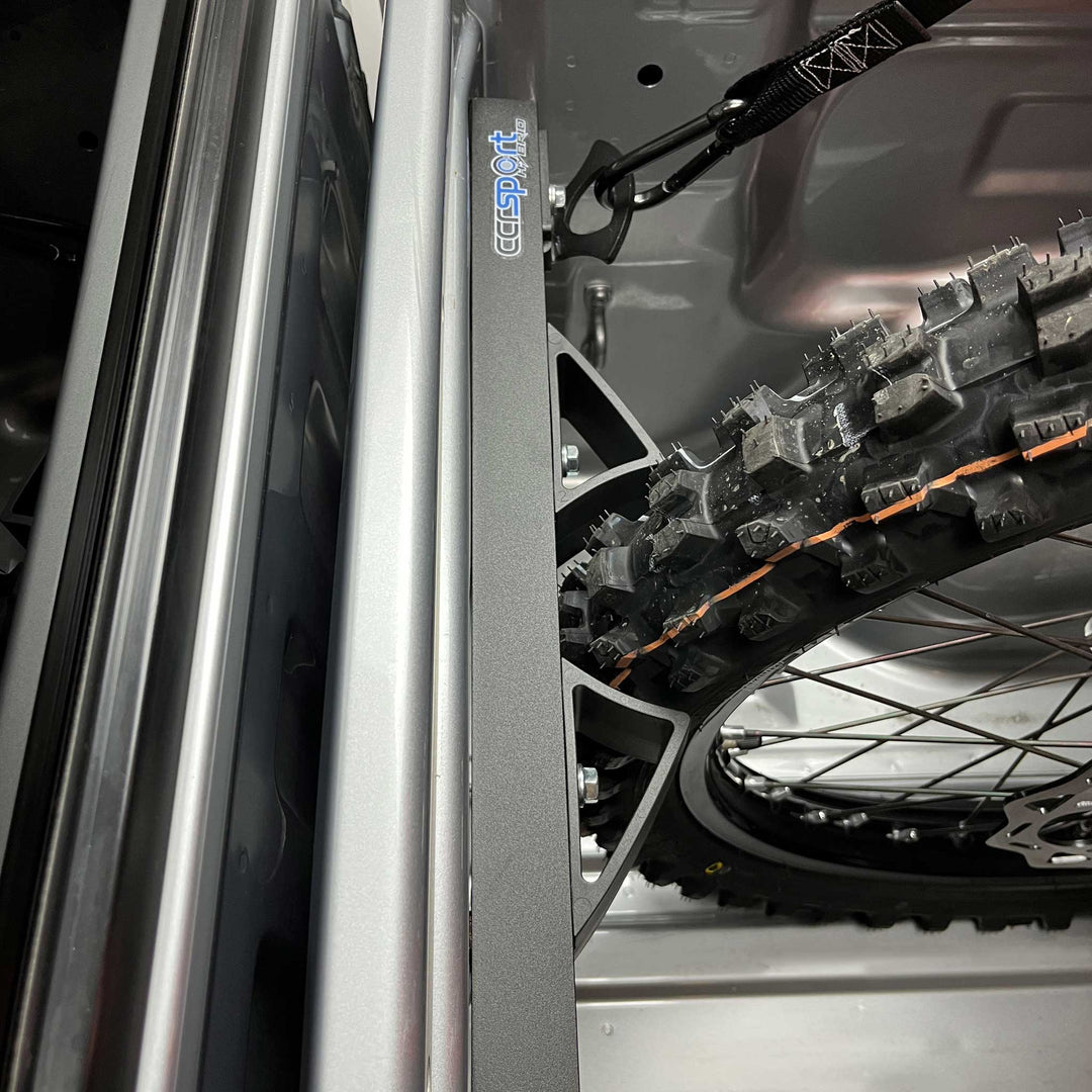 Top view of the Hybrid Rack Moto Vice fitting a motorcycle tire snugly.