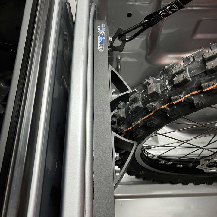 Top view of the Hybrid Rack Moto Vice fitting a motorcycle tire snugly.