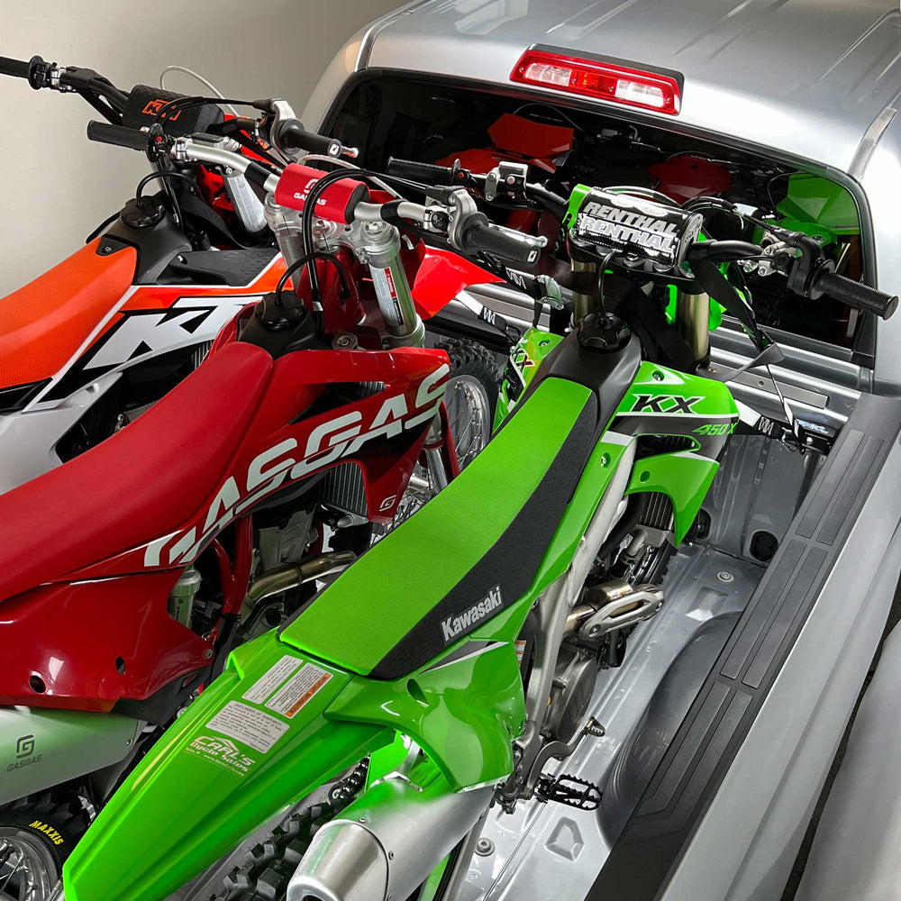 Hybrid Moto Rack Pro Pack installed in truck bed securing motorcycle.