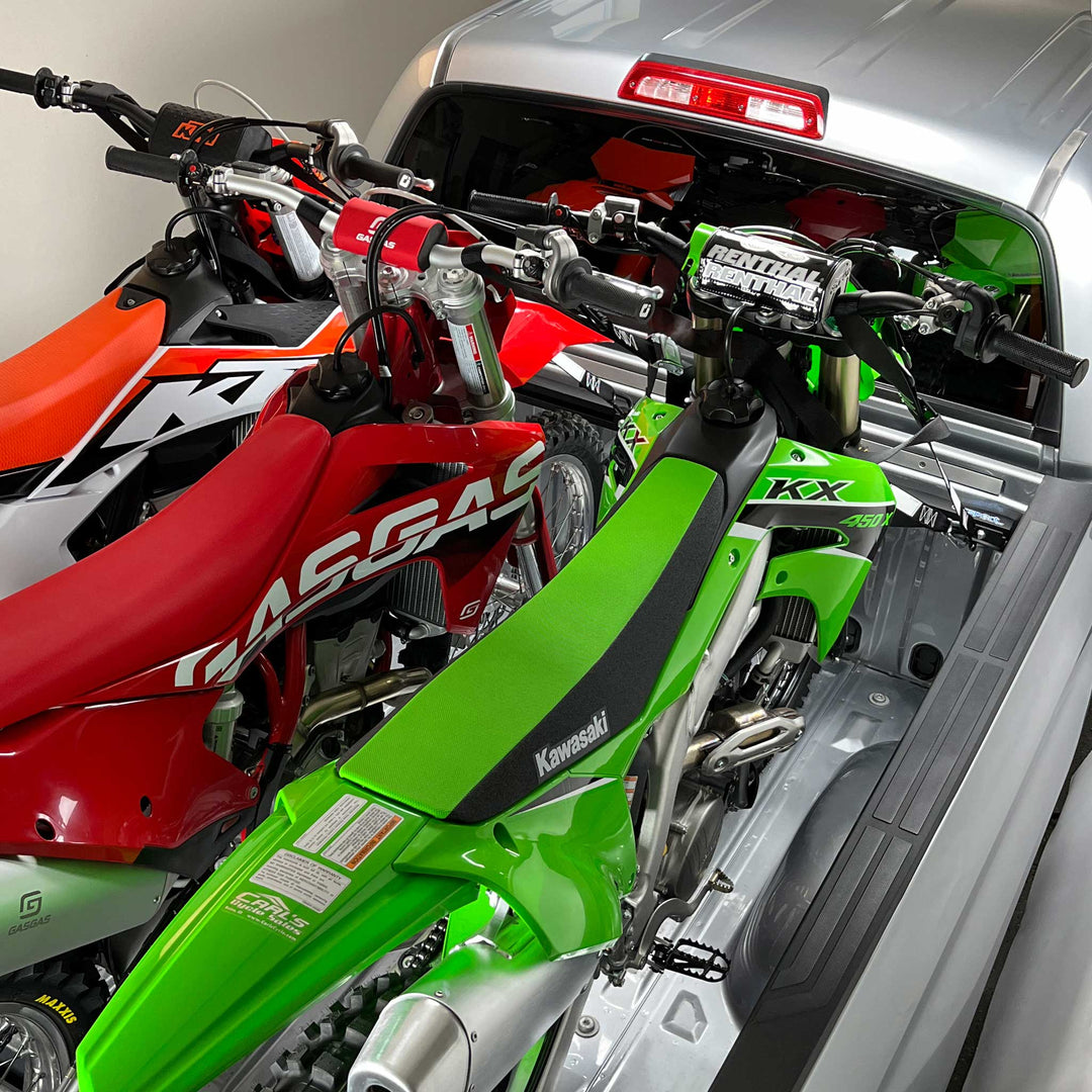 Hybrid Moto Rack Pro Pack installed in truck bed securing motorcycle.