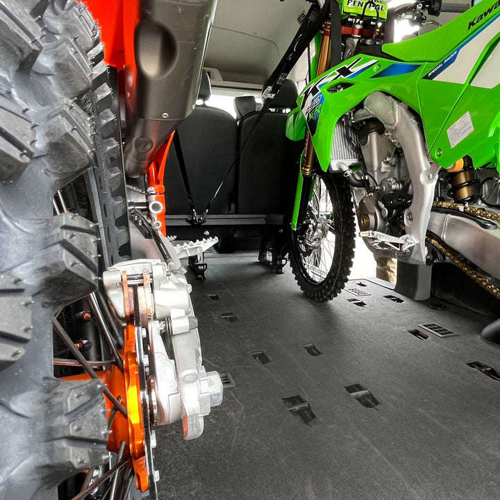 Two dirt bikes loaded in a Mercedes Sprinter van with the CCR Sport Hybrid Moto Rack.