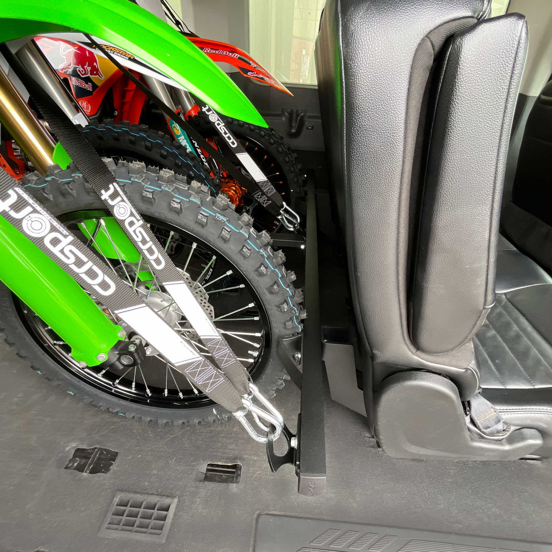 Sides view of the rear passenger seat mounted Hybrid Moto Rack with three motorcycles secured for transport.