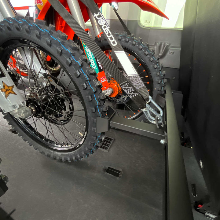 The Ford Transit X3 rack featuring the 3rd Bike Extender with a dirt bike secured.