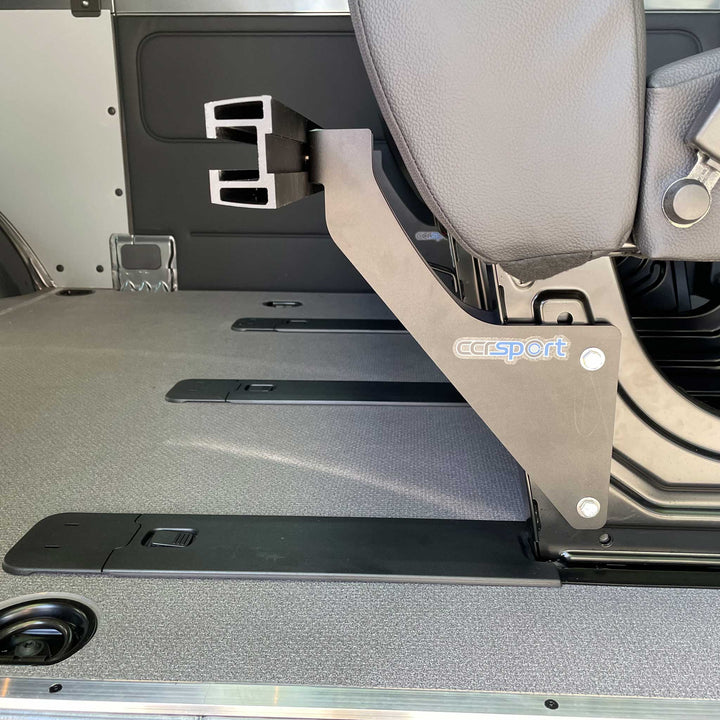 Detailed photo showing the CCR Sport Hybrid Moto Rack system fastened to the Sprinter seat base mounting bracket.