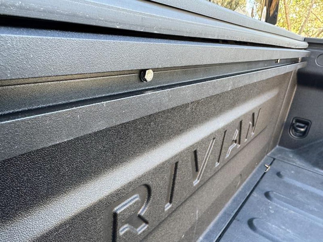 A tight detail shot of the Hybrid track mounted to the Rivian truck bed.