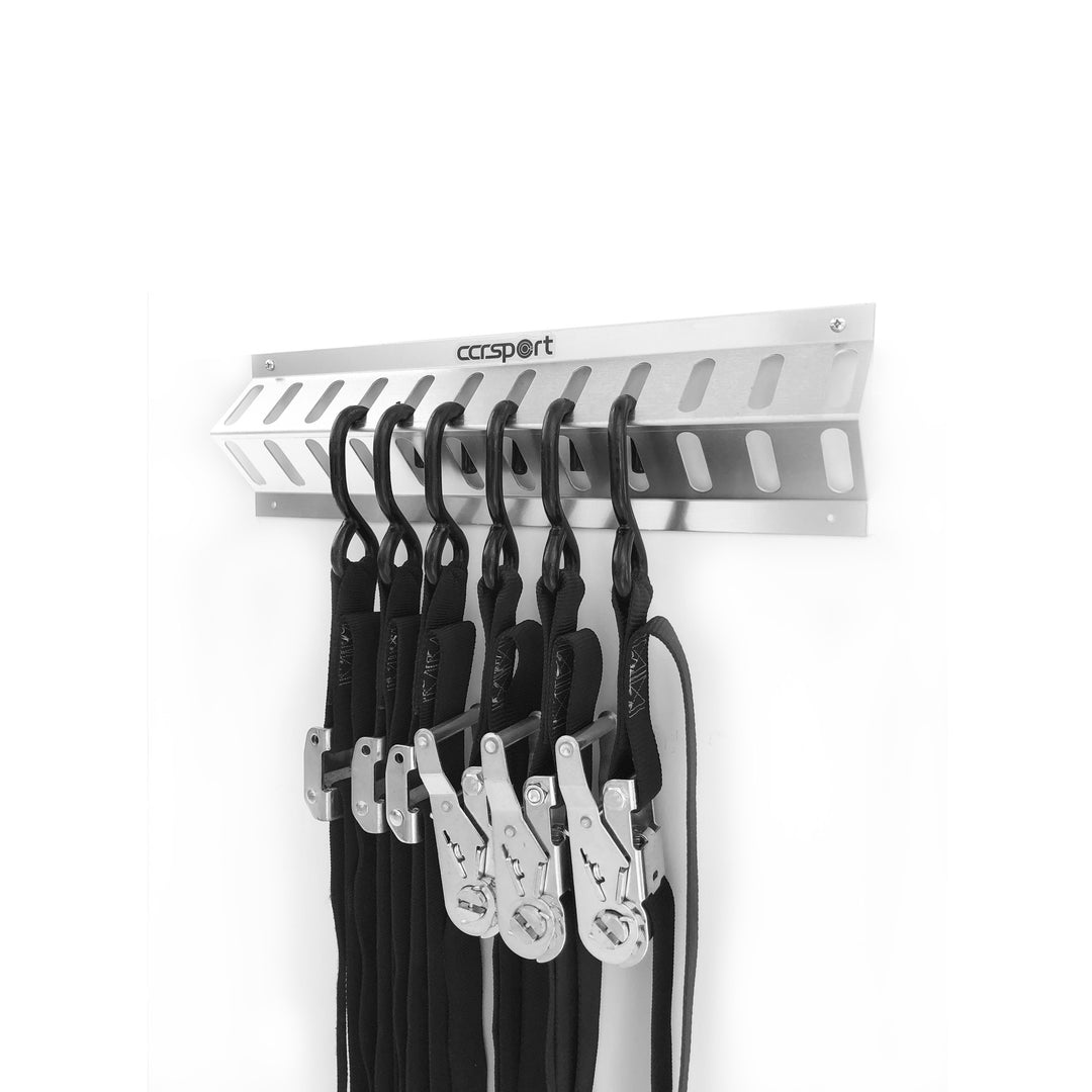 The Strap Rack mounted on garage wall with tie-downs stored.