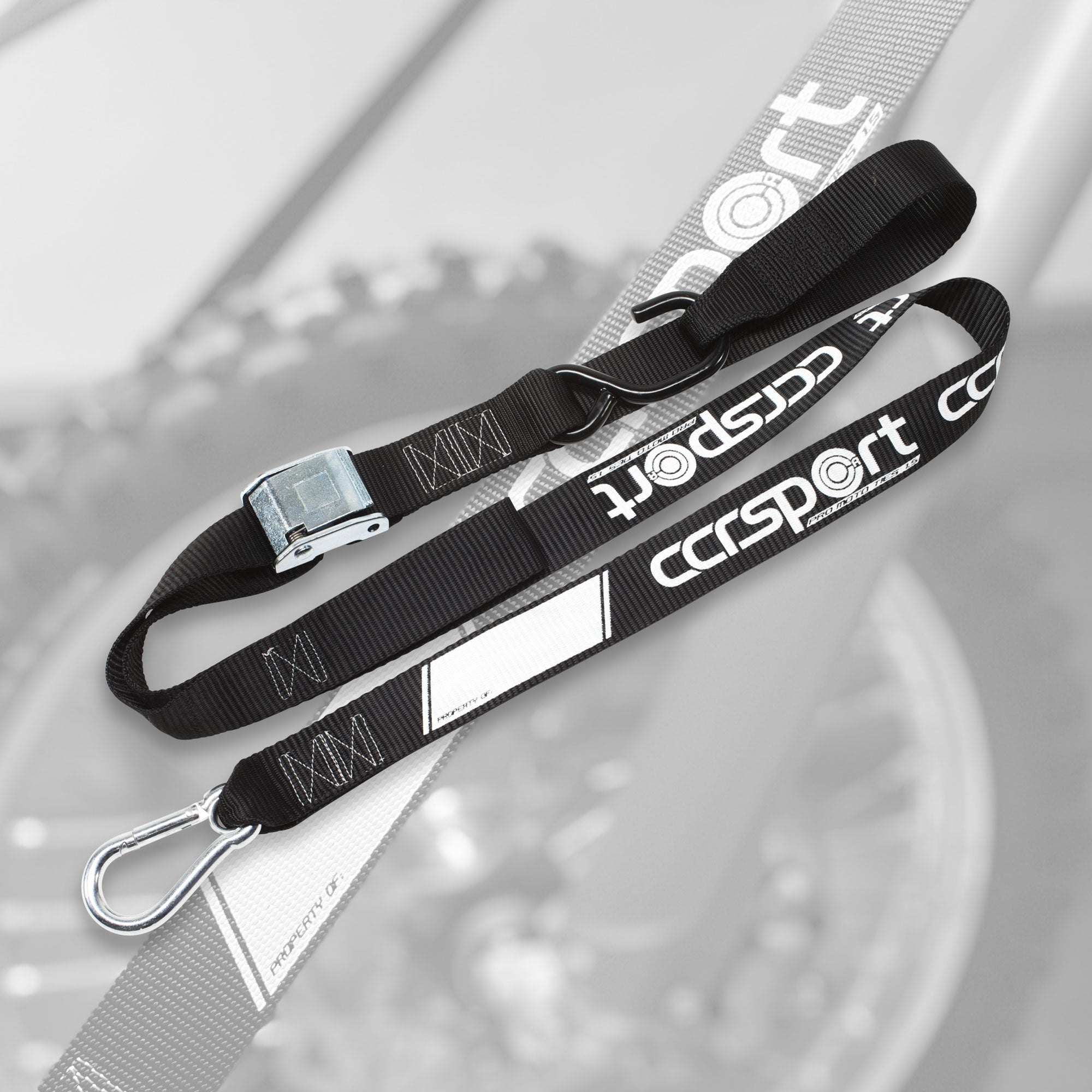 Beautiful photo of a CCR Sport Pro Moto tie down strap on a ghost background image.