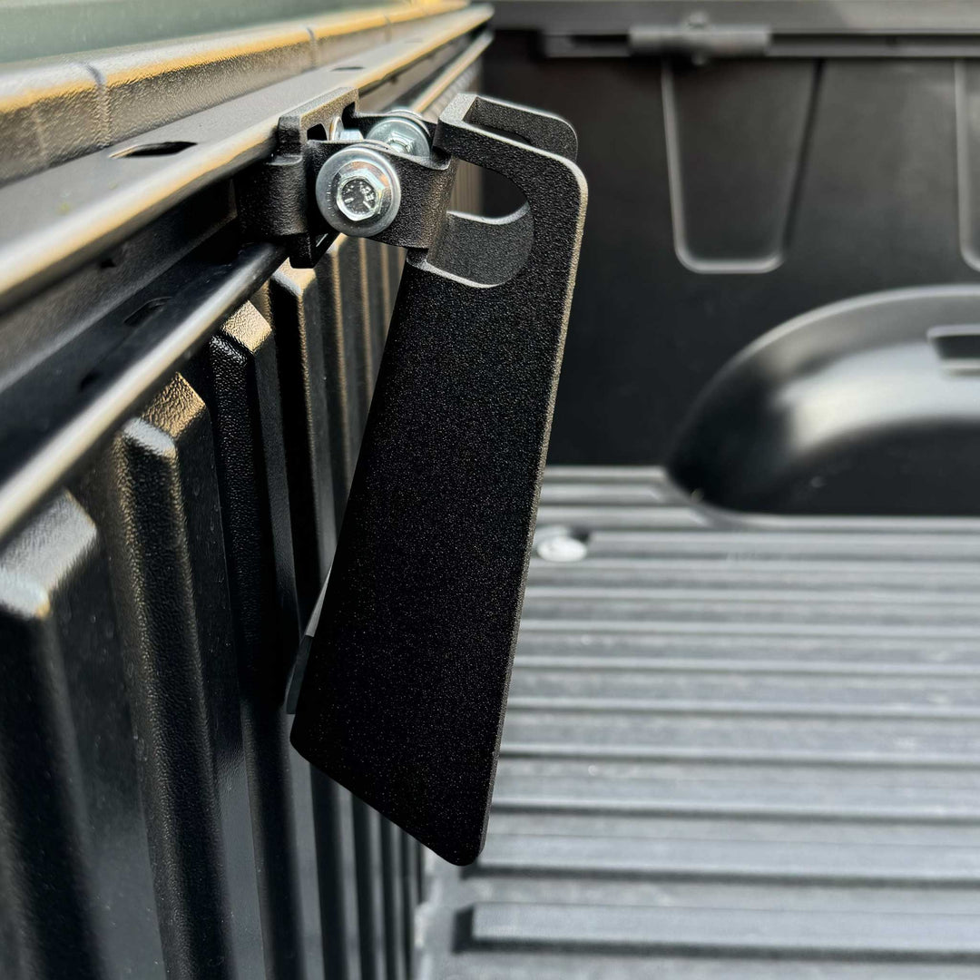 A side view angle of the CCR Sport Toyota Pivot Chock mounted to the Deck Rail of a Tundra truck.