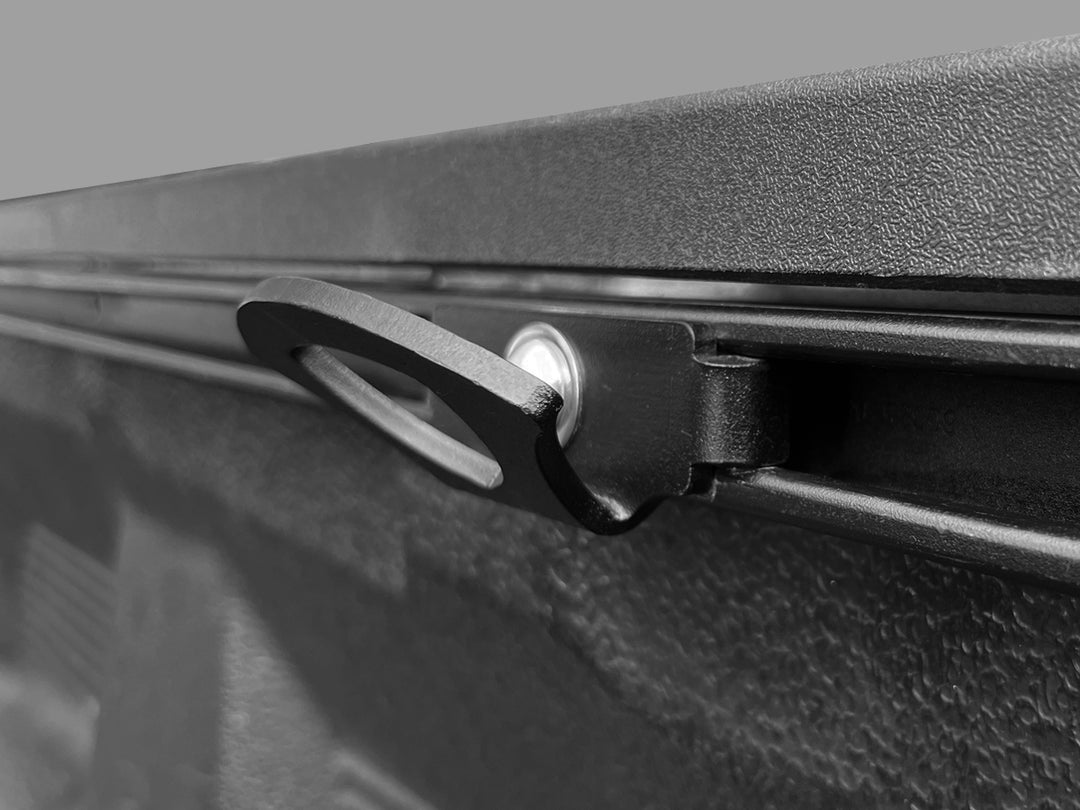 Close-up of a CCR Sport Toyot Deck Rail anchor mounted to a Toyota truck bed.