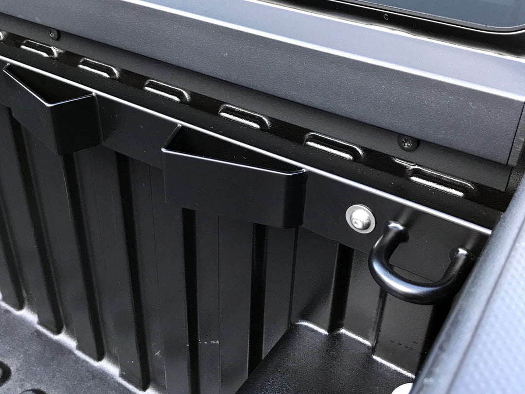 A close-up beauty shot of the CCR Sport Bed Buddy Moto Rack mounted in a truck bed.