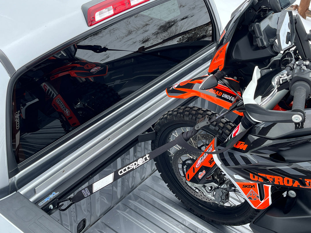KTM Adventure motorcycle secured to the Hybrid Moto Rack in the bed of a Toyota Tundra truck.