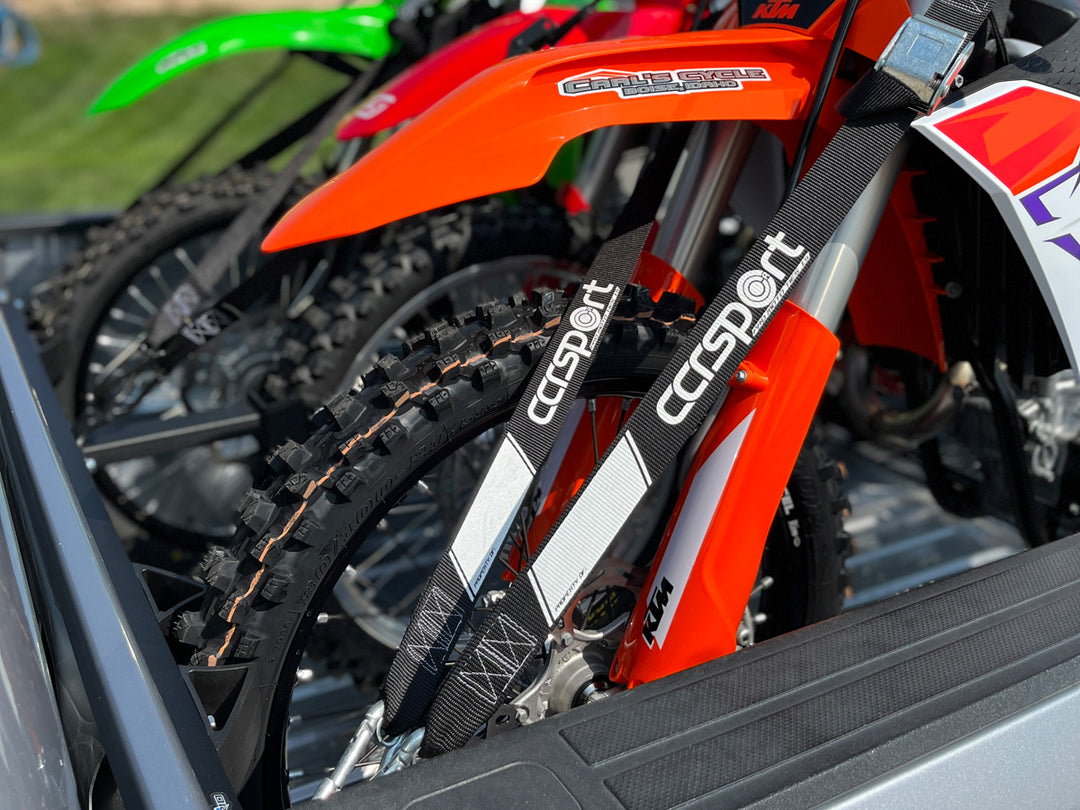 Three motorcycles strapped into the bed of a truck using CCR Sport Pro Moto Tie-Down Straps and the Hybrid Moto Rack.