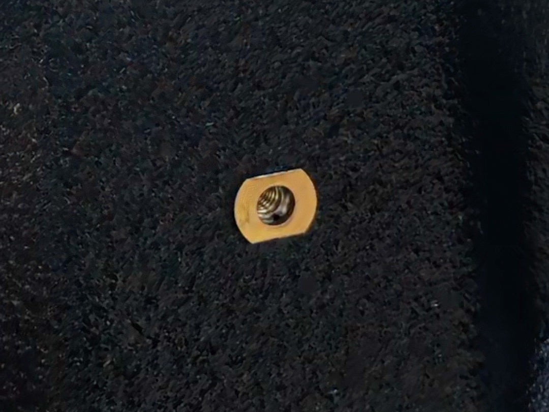 Close-up of an X-nut blind fastener installed.