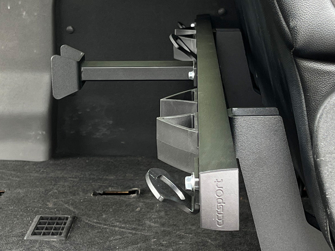 CCR Sport motorcycle transport mounting system installed behind the passenger seat in a Ford Transit van.