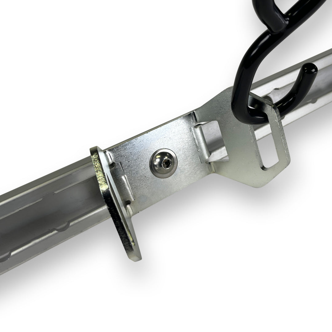 Nissan Utili-Track Moto Wheel Chock mounted to factory rail with motorcycle wheel chock attached