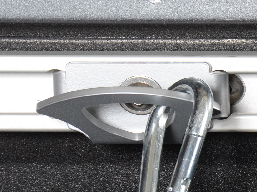 Close-up image of the CCR Sport Nissan Utili-Track Tie-Down anchor with a tie down attached.