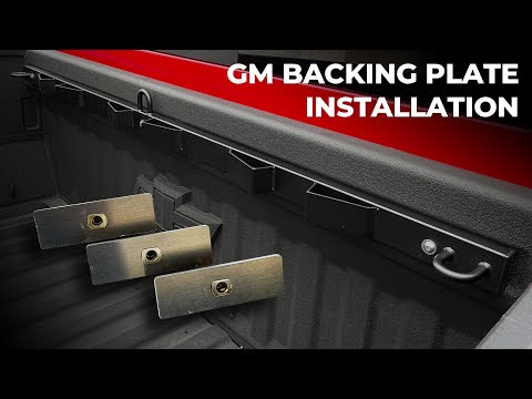 Chevy GMC truck bed threaded backing plates installation using factory bulkhead holes for secure motorcycle rack mounting